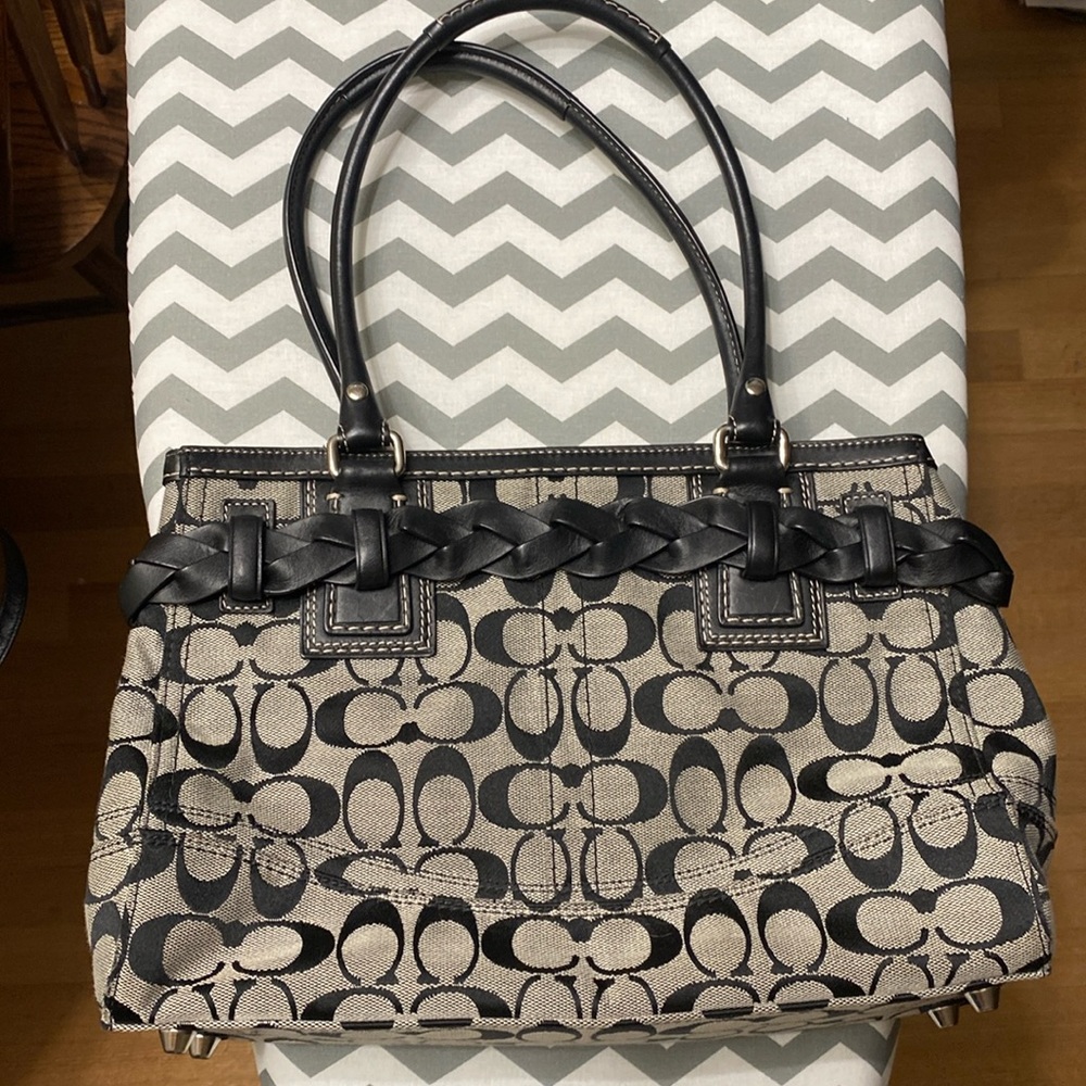 Coach brand black and grey  purse with wrap around  belt with tassel.